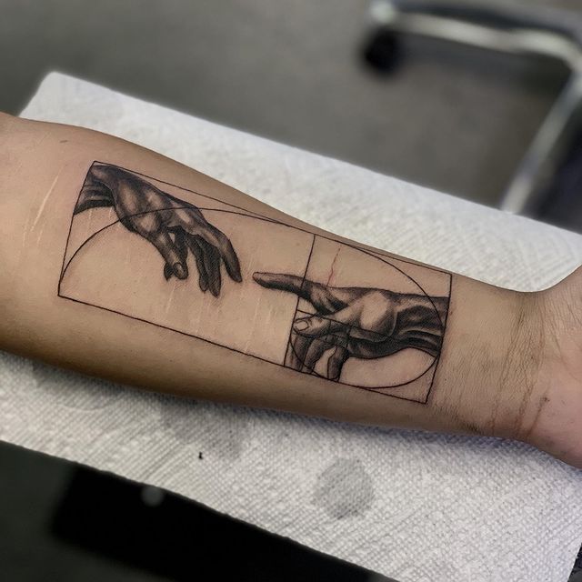 Creation of Adam Tattoo meaning and symbolism 