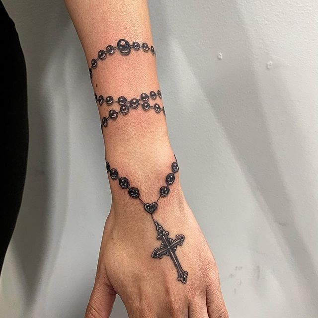Rosary hand tattoo