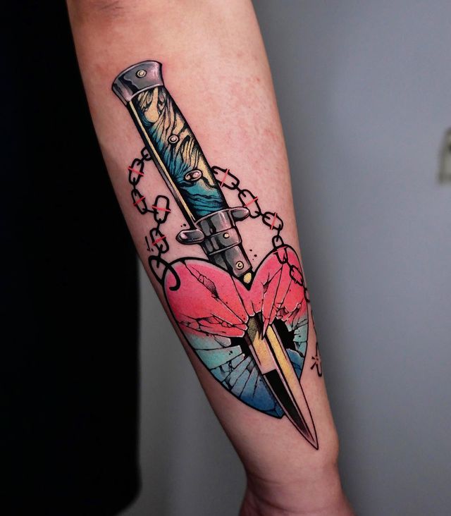 Stabbed heart tattoo arm 