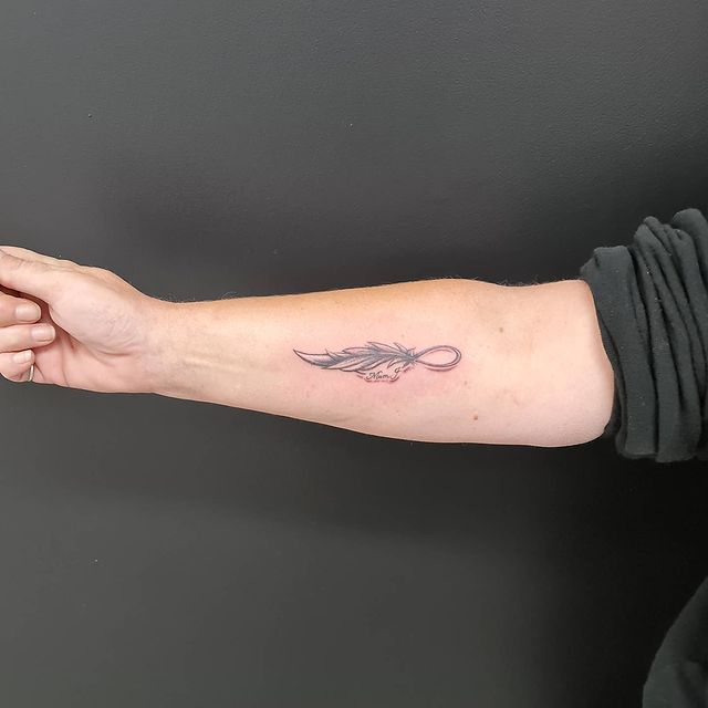 Infinity feather arm tattoo 