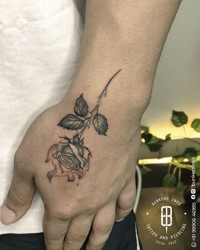 burning rose wrist tattoo 