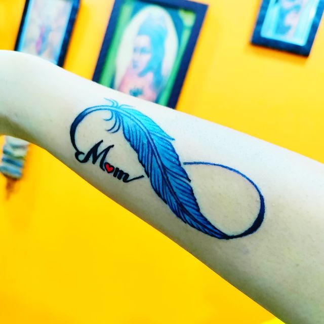 Infinity feather mom tattoo @