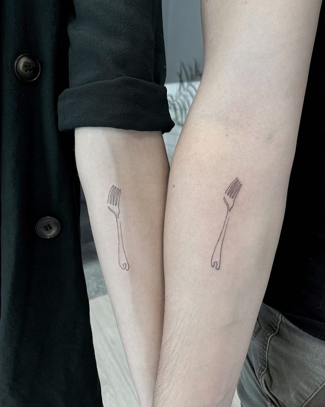 matching fork arm tattoos