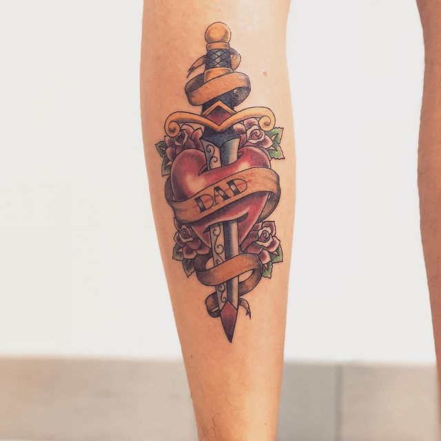 Stabbed heart arm tattoo 