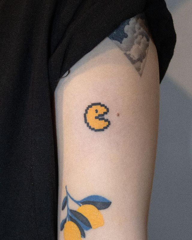 vintage Pacman arm tattoo