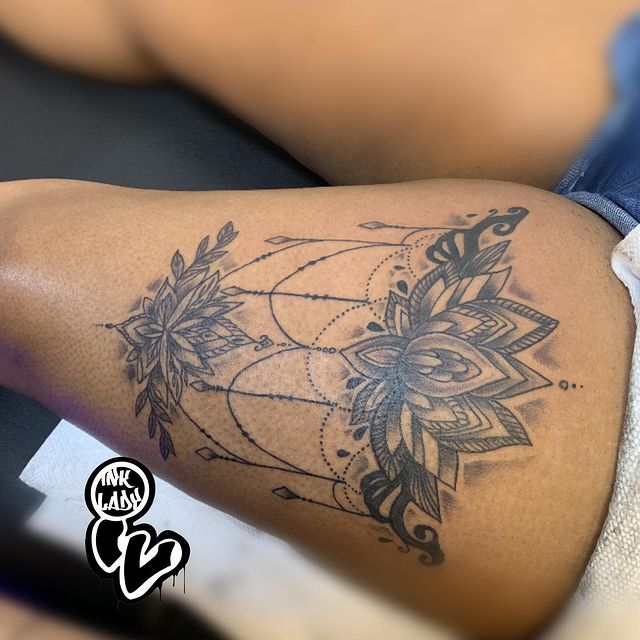 Lotus chandelier leg tattoo 