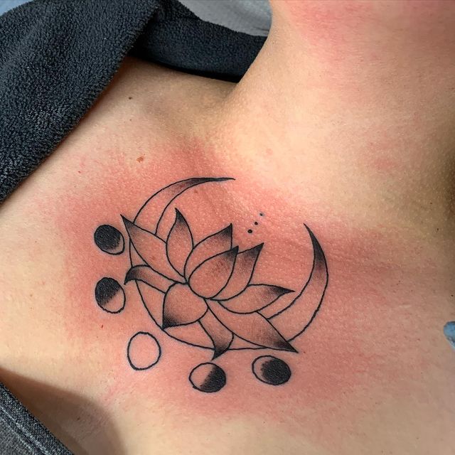 lotus and moon chest tattoo 