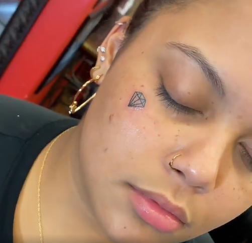Diamond tattoo under the eye