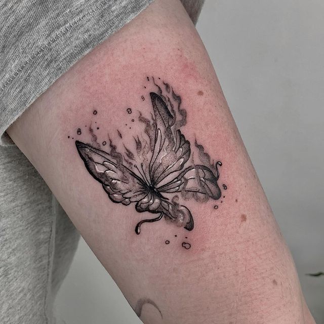 Burning Butterfly arm Tattoo 