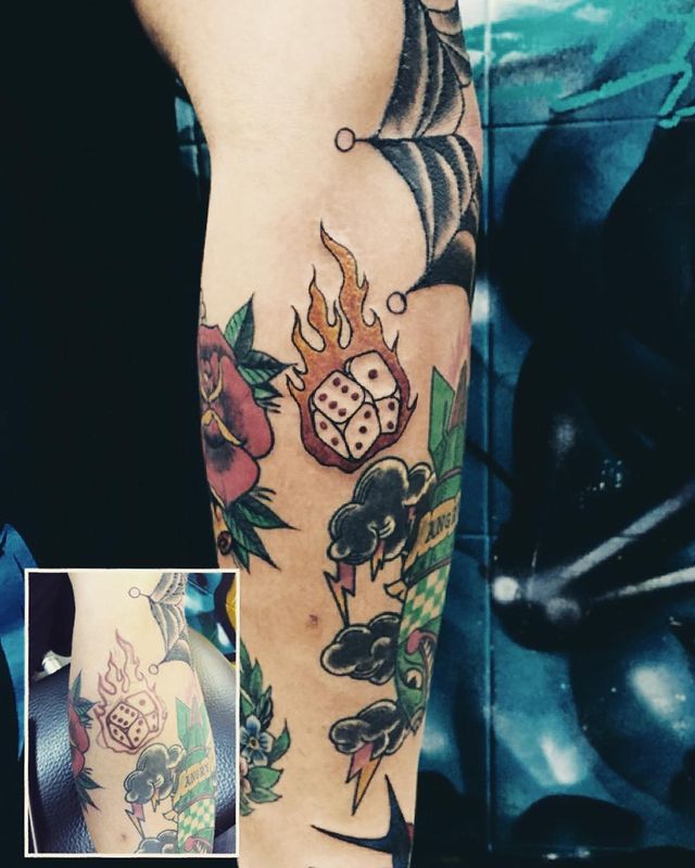 burning dice arm tattoo
