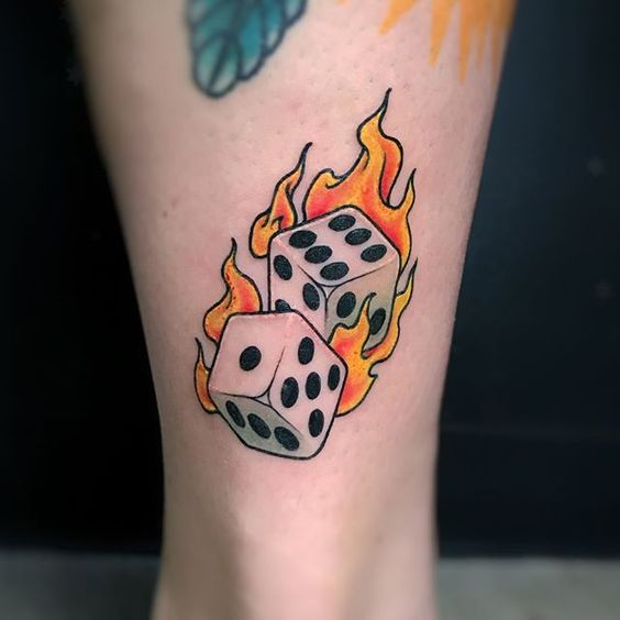 burning dice leg tattoo 