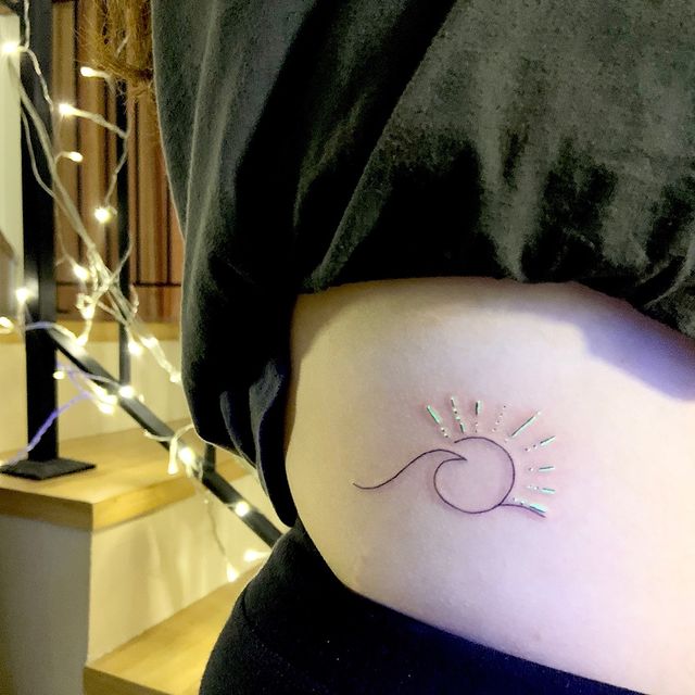 sun wave rib tattoo