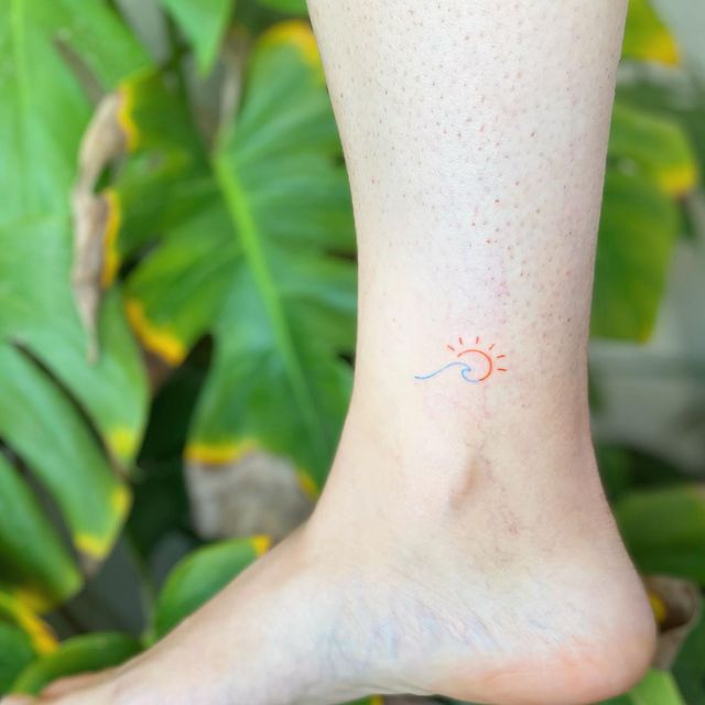 colorful sun wave ankle tattoo