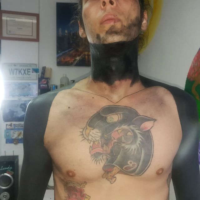 blackout neck and arms tattoo