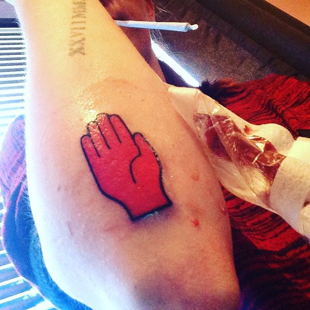 Red hand of Ulster arm tattoo