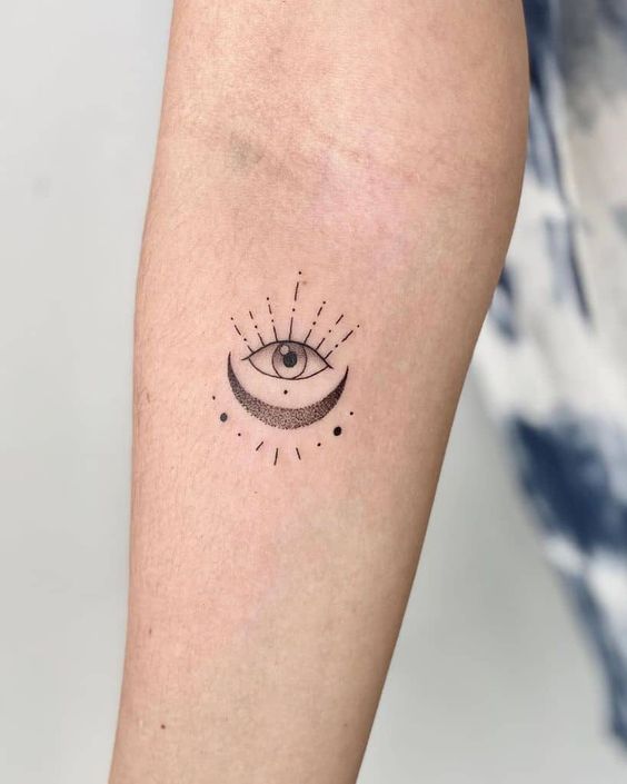 moon eye arm tattoo