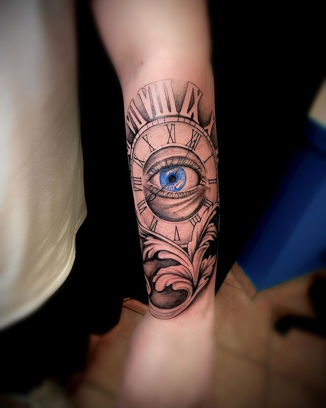 Eye and clock tattoo