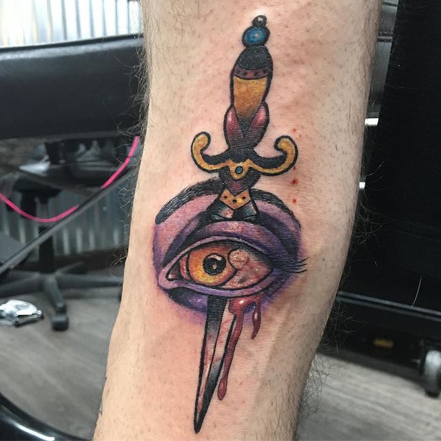 dagger thru eye tattoo