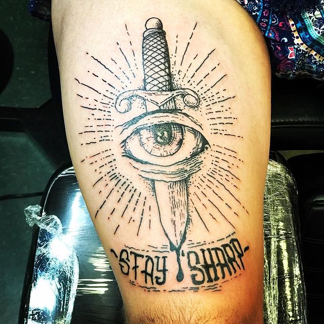 dagger thru eye tattoo