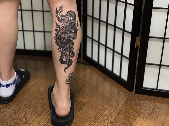 snake Cross calf Tattoo