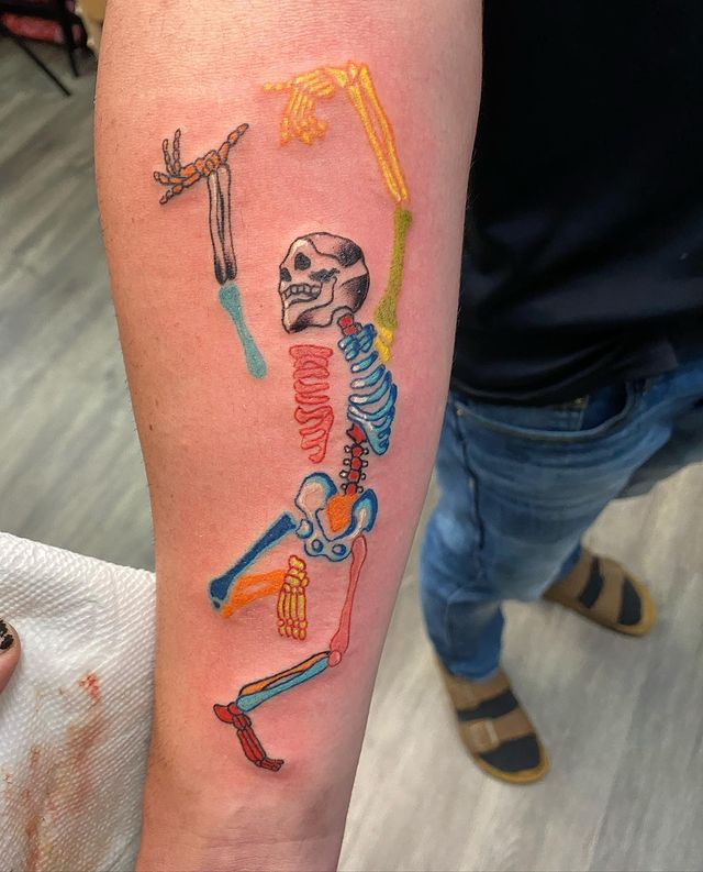 colorful Dancing skeleton arm tattoo
