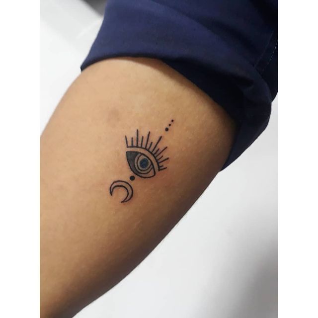 sun moon eye tattoo