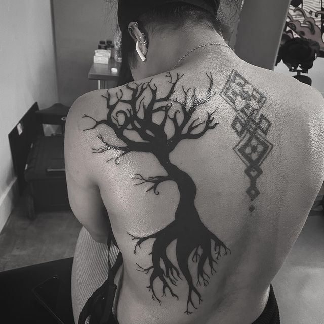dead tree back tattoo