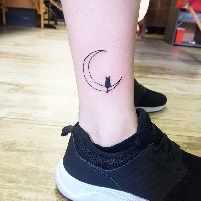 minimalist cat and moon ankle tattoo