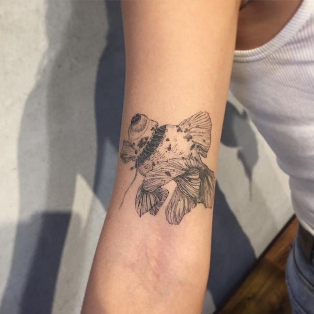 dead fish arm tattoo