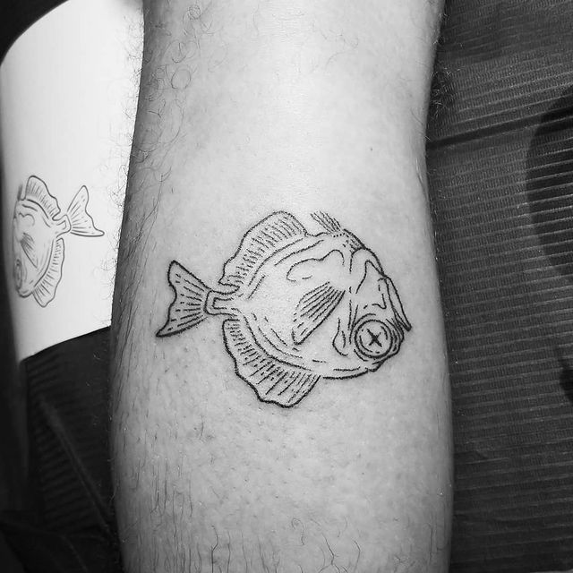 dead fish arm tattoo