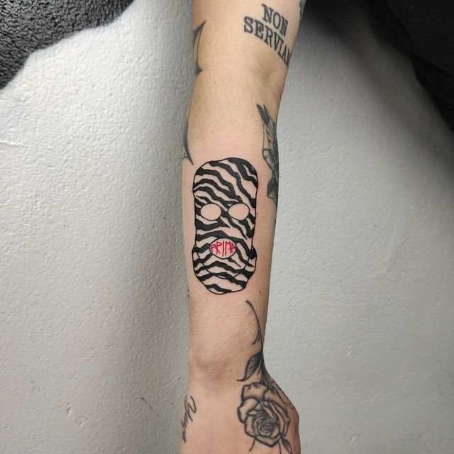 ski mask arm tattoo