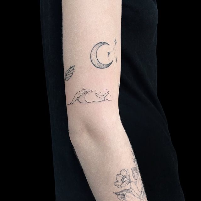 fishtail arm tattoo