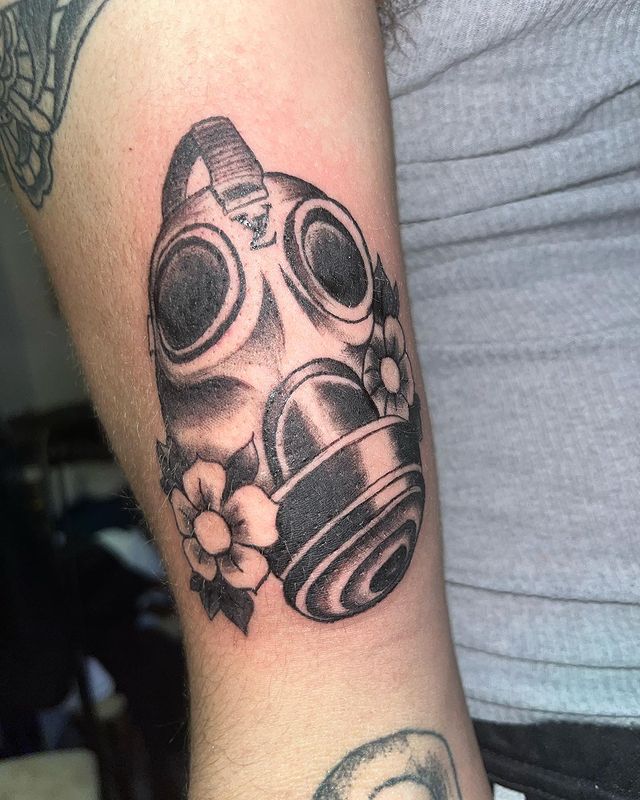 The flower with gas mask tattoo