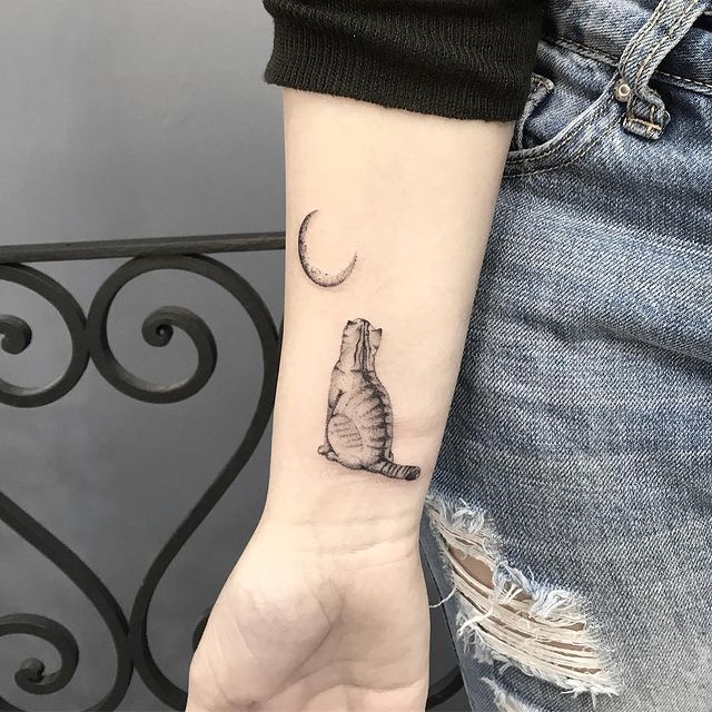 Cat and Moon arm tattoo