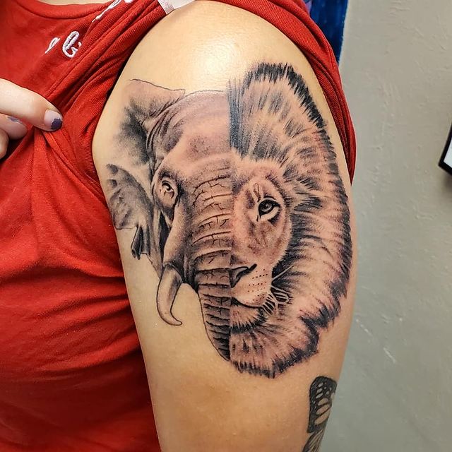 Lion and elephant shoulder tattoo