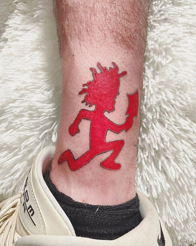 Red Hatchetman tattoo on the ankle