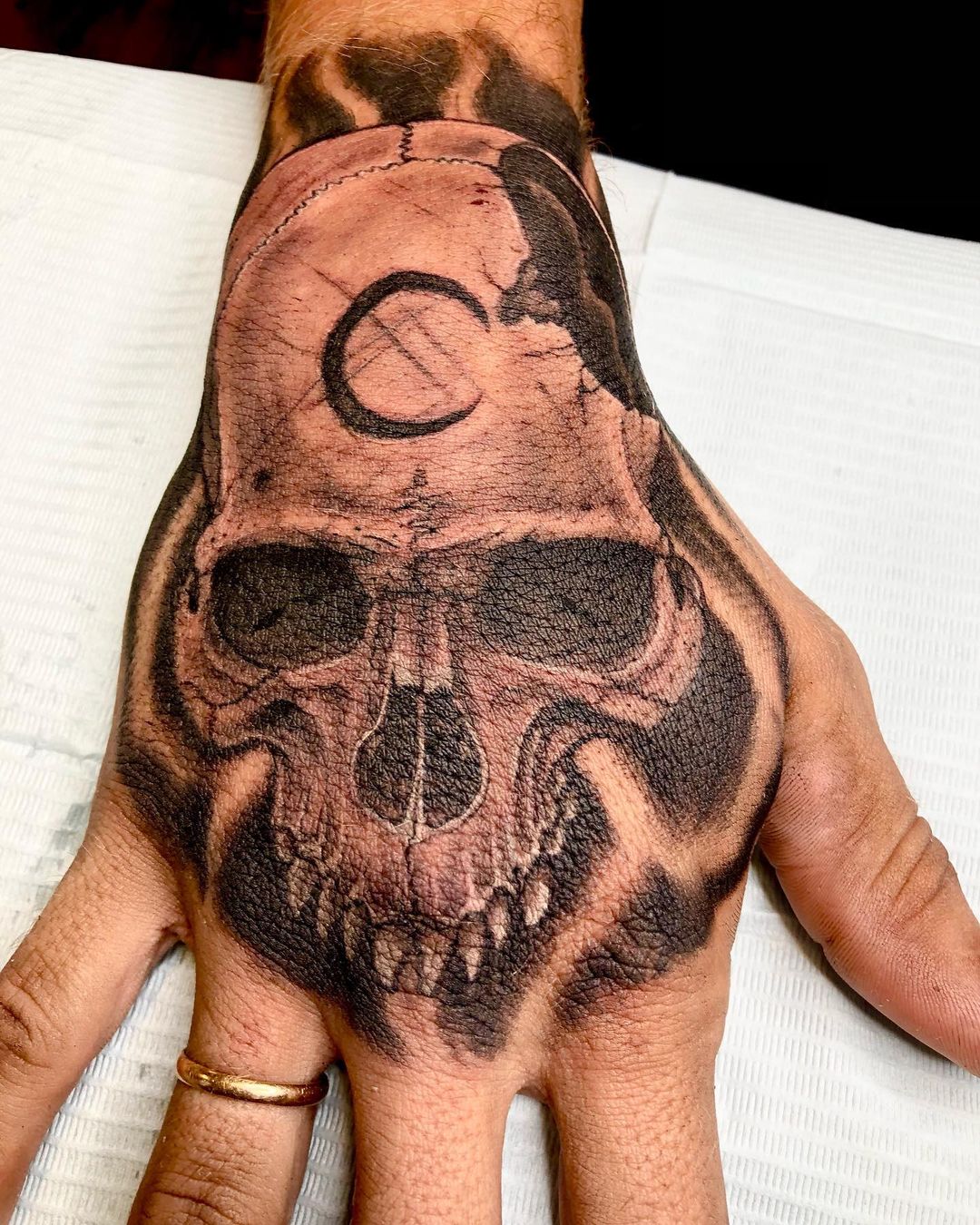 Skull on hand tattoo